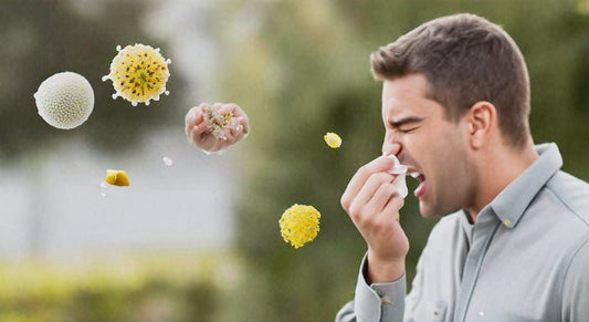 man sneezing due to pollen
